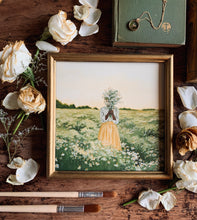 Load image into Gallery viewer, On a worn table there is the painting of the girl holding daisies. Around the painting is scattered white roses that are no longer fresh. They have a gold tinge to the edges of the petals. There is an old green book with a necklace with a thin gold chain on it. There are also some paintbrushes.
