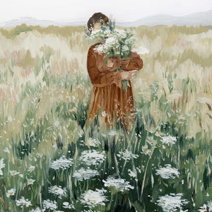 close-up view of the girl holding a bunch of queen Anne's lace flowers